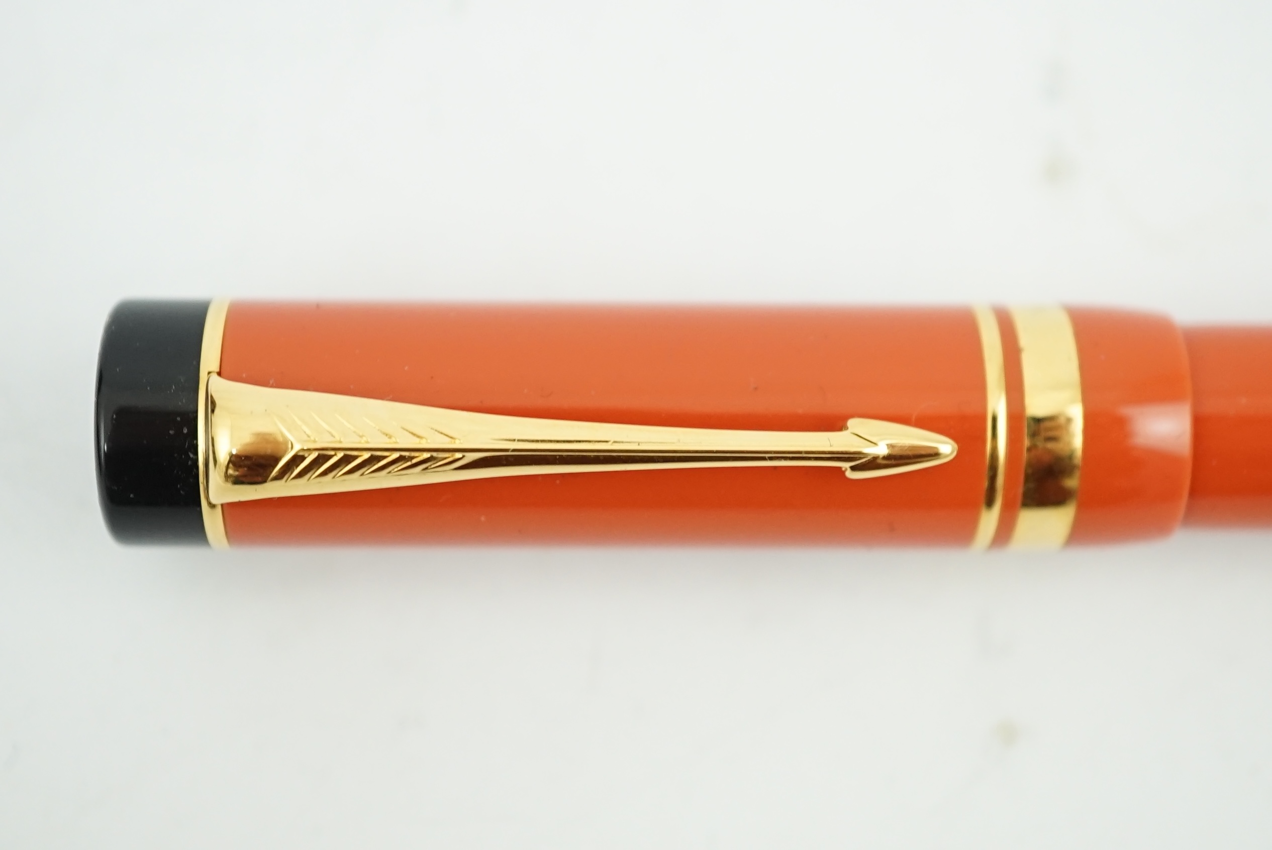 A Parker Duofold orange international fountain pen, in cherry wood presentation case